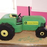 John Deere Tractor Chocolate cake with peanut butter filling covered in fondant. First time making a vehicle of any kind!