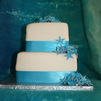 Wedding By The Sea This is my first wedding cake! I am very happy with how it turned out. MMF and sugar flowers.