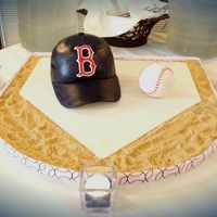 Red Sox Baseball Hat And Ball Hat made from Wilton ball pan and a 6" round. Carved a bit around the sides to make look realistic. Brim and letters made from...