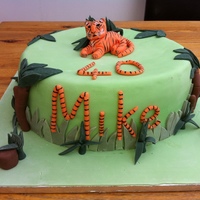 Tiger A large (12") Victoria Sponge with fondant icing decoration. Used an icing pen for the detail on the tiger figure and on the name and...