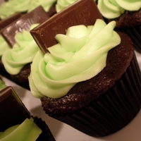 Andes Mint Cupcakes Chocolate cupcakes with mint flavored cream cheese icing and topped with an Andes Mint.