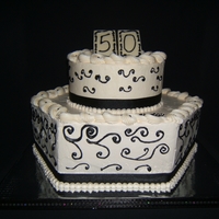 50Th Birthday Celebration 50th birthday cake in black and white. Bottom cake is 4 layers of white cake with strawberry filling, top cake is lemon with lemon filling...