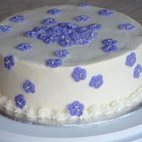 Violet Cake This is a chocolate cake with raspberry filling and BC. The violets are royal icing.