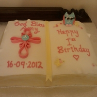 Amy's Baptism And Birthday Cake A combined first birthday and baptism cake for my beautiful niece Amy. Chocolate cake with fondant decorations, one page for her birthday...