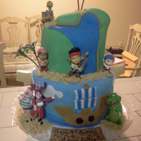 Jake & The Neverland Pirates Birthday Cake Chocolate cake with chocolate frosting, covered in fondant. Figurines were purchased, all other decorations are fondant.