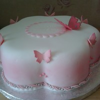 Flutter By Butterfly petal shaped fondant iced cake with fondant butterflies and name plaque although you cannot see the name as it hasn't shown up very...