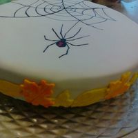 Spider & Web Quick cake I made for work. Pumpkin Spice cake covered in fondant, Hand drawn web and spider. Fondant leaves
