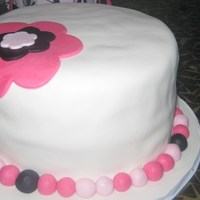 Chunky With A Hat Fondant cake with fondant accents.