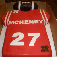 Football Jersey Cake Lemon cake w/lemon BC. Covered with Duff's red fondant. Football was RKT covered w/modeling chocolate. MMF accents. Inspiration from...