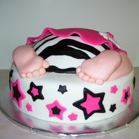 Rockstar Baby The zebra print on the diaper is hand painted, the rest is fondant accents.