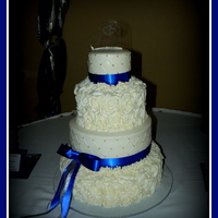 Royal Blue And Rosettes This is a 5", 8", 11" and 14" cake. All buttercream, rosettes and quilte pattern with silver dragees. Thanks for...