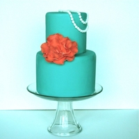 Teal Cake With Pearls This was a 6 inch and 4 inch round. Gumpaste fantasy flower and pearls.