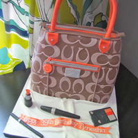 Coach Purse Cake! Coach purse cake made for a 39th birthday! Vanilla cake with Strawberry filling, all edible.