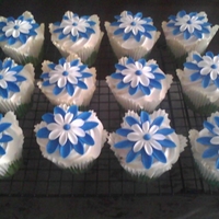 Blue And White Cupcakes With Fondant Flowers chocolate with peanut butter filling and coconut pineapple cupcakes with heavy whipping cream