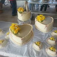 3 Tier Heart Shaped Wedding Cake With 8Mini Cakes Carrot Cake With Cream Cheese Icing Silk Flowers On Large Cakes And Royal Icing Flower *3 tier heart shaped wedding cake with 8mini cakes. Carrot cake with cream cheese icing. Silk flowers on large cakes and royal icing...