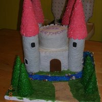 Castle Cake My daughters 4th Birthday cake. Lemon cake w/ strawberry filling. Towers are RKT covered in BC and fondant, tops are waffle cones, trees...