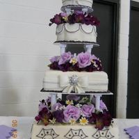 4 Tier Purple Wedding Cake 4 tier wedding cake. 16" square bottom, 12" square, 9" Petal, and 6" round top. MMF, fondant bows and ribbon, and...