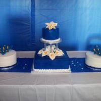Tuttle Wedding! This is my first wedding cake!! 12" Square with 6" rpund and then 2 9" rounds with cala lillies on tops!!