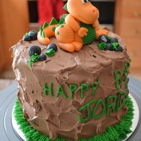 Dino Birthday handmade gumpaste dino and rocks.