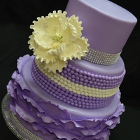Purple And Bling This cake was created for my cousin for her 30th birthday. Hard to see in the pics but the entire cake has been sprayed with edible pearl...