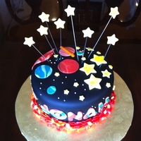 Space Cake Used fondant, and lots of marbling to get the planet look.