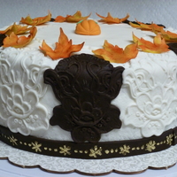 Chocolate Fudge Cake With White Chocolate Mousse Filling Covered In Buttercream With Fondant Decorations Chocolate fudge cake with white chocolate mousse filling, covered in buttercream with fondant decorations.