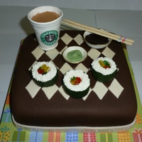 Sushi And Starbucks Caramel cake with chocolate frosting, covered in fondant with fondant/gumpaste decorations.