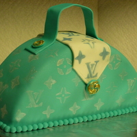 Yellow Cake With Buttercream Frosting Covered In Teal Fondant And Fondant Decorations Stencil Design Yellow cake with buttercream frosting, covered in teal fondant and fondant decorations. Stencil design.