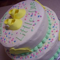 Sarah's Baby Shower Cake Bottom layer red velvet, top layer carrot, cream cheese frosting and gumpaste accents