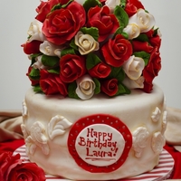 Elegant Birthday Cake Red velvet cake with cream cheese frosting. There are 60 roses on the bouquet that took about 6 hours to make but it was worth it!