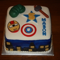 Avengers Cake This is an avengers themed cake I did for a customer. Everything is MMF and the sides are hand painted blue with MMF buildings. Thanks for...