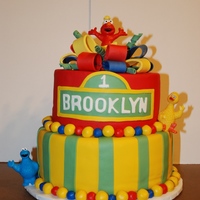 1 Yr Old Elmo Birthday Cake We made this cake for a one year old who LOVES Elmo. Bottom tier is white cake with buttercream icing. Top tier is chocolate with raspberry...