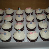 Baby Shower Cupcakes Baby Shower cupcakes with pink pins, bottles, and rattlers.