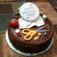 Embroidery Basket Cake Basket Cake with embroidery hoop, thread, scissors pin cushion, thimble, floss, measuring tape and scissors