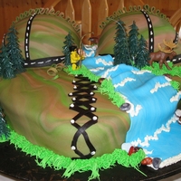 Hubbys 40Th My husband jokingly said he wanted a boobie cake for his birthday. It is a camo corset that I used for the outdoors fishing backdrop. Seems...