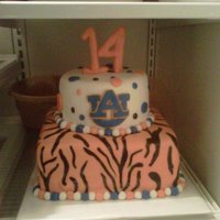 Auburn Cake 2 Tier Auburn Cake with Tiger Print on bottom and polka dots and emblem on top..