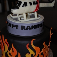 Firefighter's Helicopter Made this cake for a Firefighter Helicopter Pilot. Helicopter made out of RKT and modeling chocolate. It was little tricky because it was...