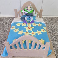 Buzz Lightyear Fondant Head and Footboard. Made stencils for these and cut them out