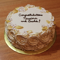 Bridal Shower Cake A simple 8" vanilla cake with rosettes in BakingJeannie's fluffy American BC and gold accents.