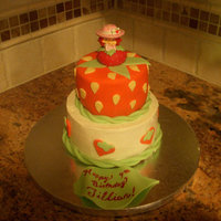 Strawberry Shortcake Top tier is MMF with SS figurine. Bottom tier is SMB with fondant decorations.