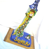 Tangled Cake First and foremost I know the cutting board is ugly...lol. But this cake is just going to a kids pizza place tomorrow, and I didn't...