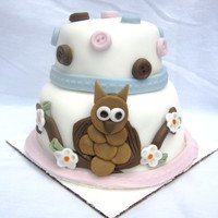 Miniature Owl Cake Bottom tier is only 4 inches in diameter and top is close to 2 inches. Fondant accessories, made buttons with mold from Michael's.
