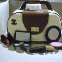 First Purse Cake Only Make Up Handle And Front Flap Are Fondant The White Cap Under The Handle Is Temporary Only To Hold Handle Up Til First purse cake. Only make-up, handle and front flap are fondant. The white cap under the handle is temporary, only to hold handle up till...