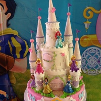 Disney Princess Cake 14 inch Rice Krispie Treat cake with 8 inch white almond with raspberry & 6 inch lemon. Made for my Granddaughter's Birthday.