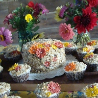 Fancy Carrot Cake Carrot cake and cupcakes with fondant flowers. These were made for our anual neighbor's picnic.