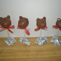 Bear Cake Pops These are chocolate cake mixed with buttercream icing, rolled into a ball and covered in candy melts. They taste sooo good :)
