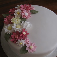 Flowers For The Lady Assorted Sugar Daisies and Vanilla Cake filled with Vanilla Buttercream and covered in fondant
