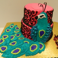 Buttercream Peacock 2 tier stacked cake decorated with buttercream icing