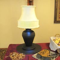 Lampshade Cake This is a 7 layer cake carved to look like a lamp and covered in an off white buttercream, the base was made from an actual lamp base. My...