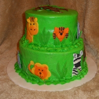 Jungle Animals Baby Shower Cake 6-inch lemon cake tier and 8-inch yellow cake tier. Buttercream frosting with marshmallow fondant details. Made for a baby shower with a &...